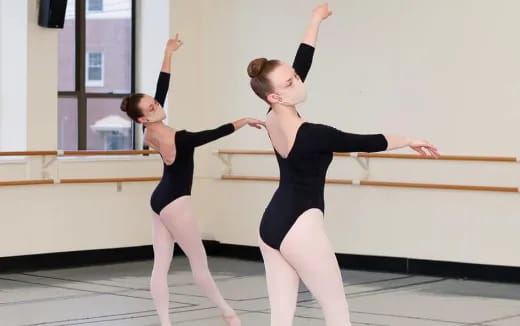 a couple of women dancing