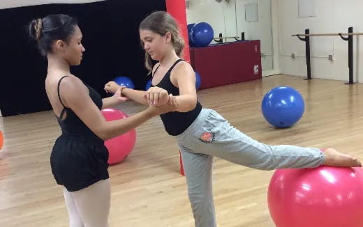 a couple of women exercising