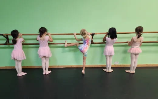 a group of girls in dresses