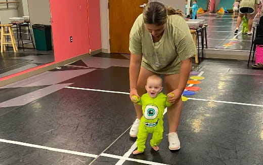 a person holding a baby