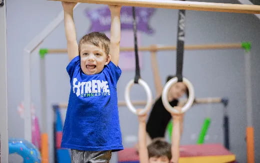 a boy holding a ball