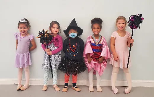 a group of girls wearing clothing