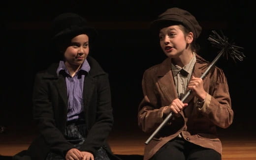 two men in black jackets