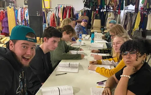 a group of people sitting at a table