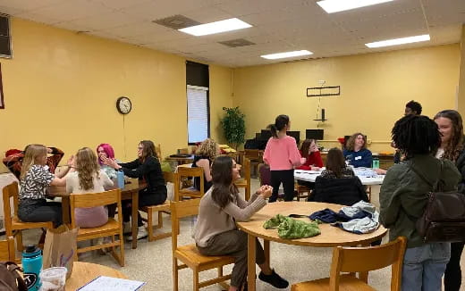 a group of people sitting at tables