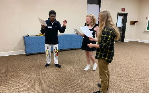 a group of people standing in a room