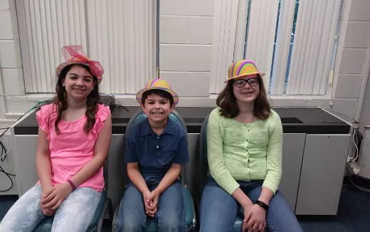 a group of people sitting on a bench