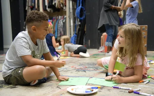 a boy and girl painting