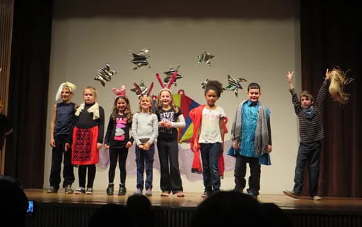 a group of children on a stage