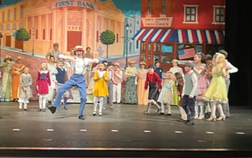 a group of people walking down a street