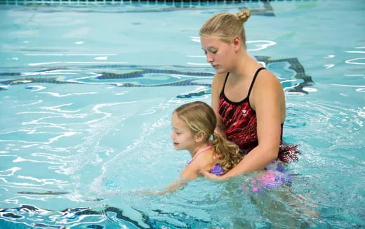 a woman and a child in the water