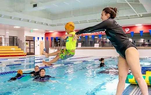 a group of people in a pool