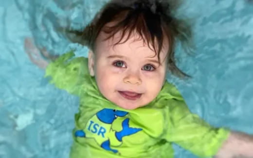 a child in a green shirt