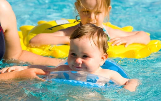 a baby in a pool