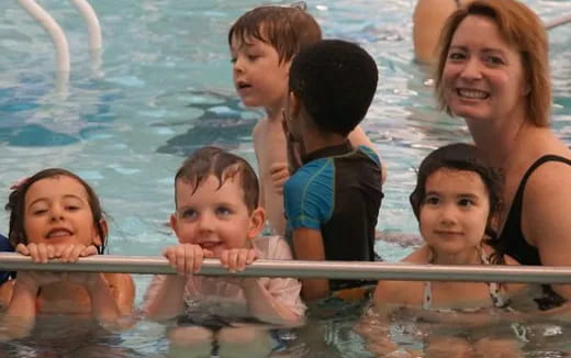 a group of kids in a pool