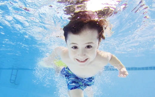 a boy in a pool