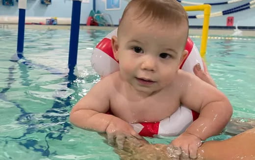 a baby in a pool