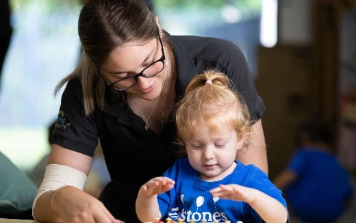a person holding a baby