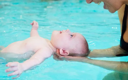 a baby in a pool