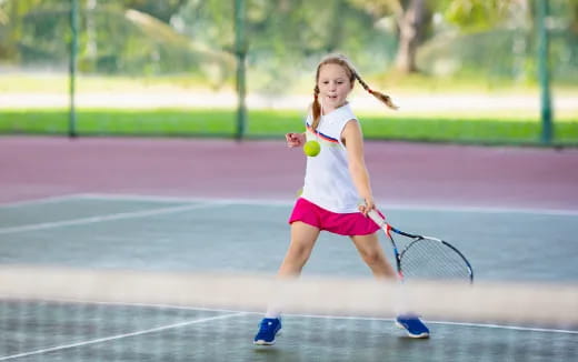 a girl playing tennis