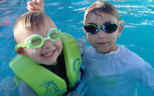 two boys in a pool