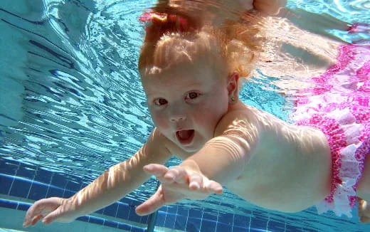 a baby in a pool