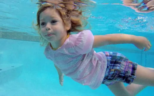 a girl in a pool