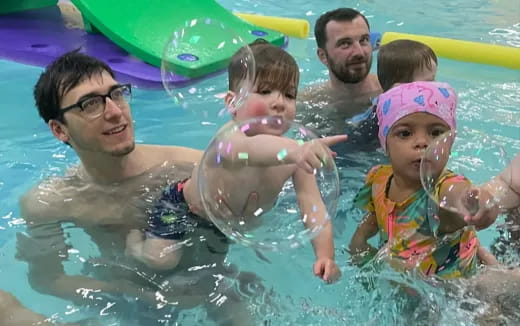 a group of people in a pool