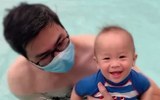 a person holding a baby