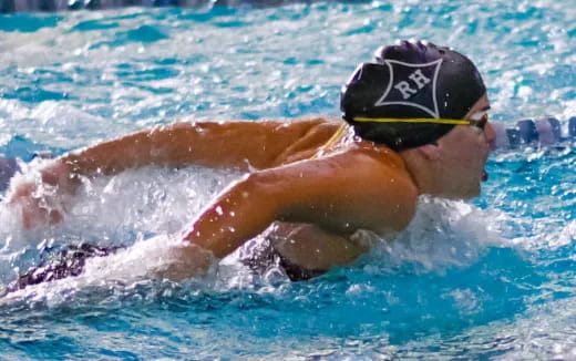 a person swimming in a pool