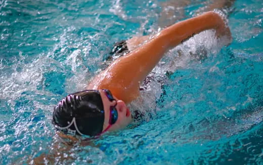 a person swimming in a pool