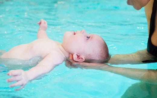 a baby in a pool