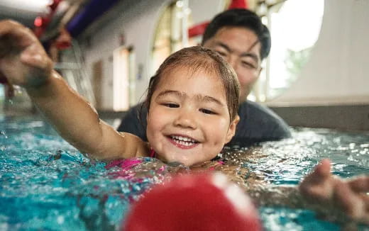 a boy in a pool