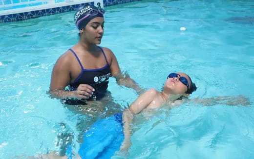 a man and woman in a pool