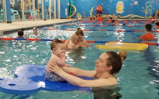a group of people in a pool
