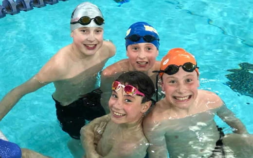 a group of people in a pool