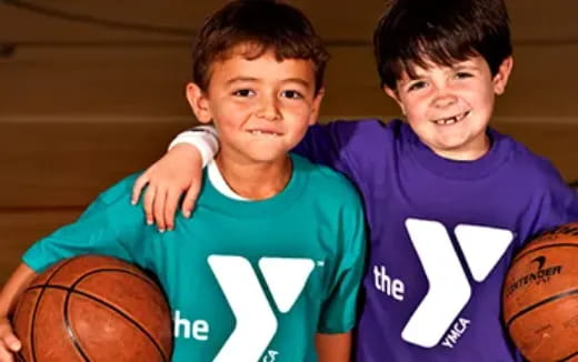 two boys holding basketballs