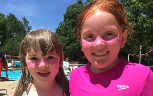 a boy and girl with paint on their face