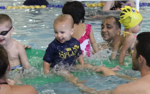 a group of children in a pool
