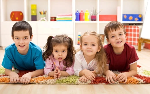 a group of children sitting on the floor