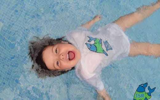 a child lying on a bed