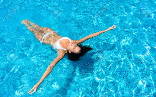 a person swimming in a pool