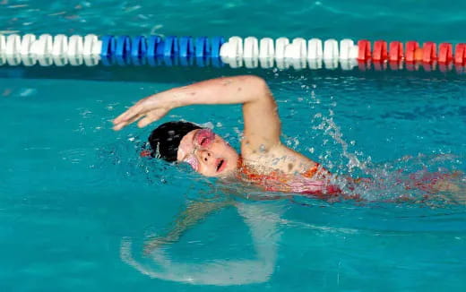 a person swimming in a pool