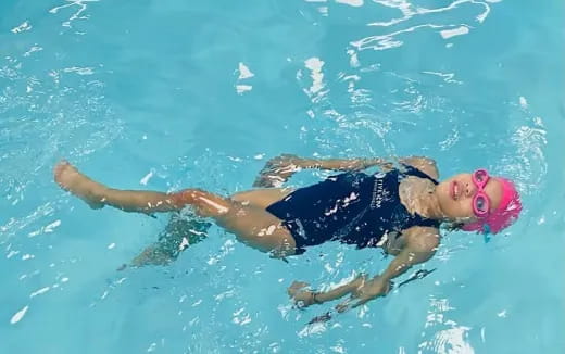 a person swimming in the water