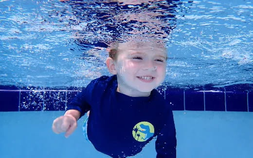 a boy in a pool