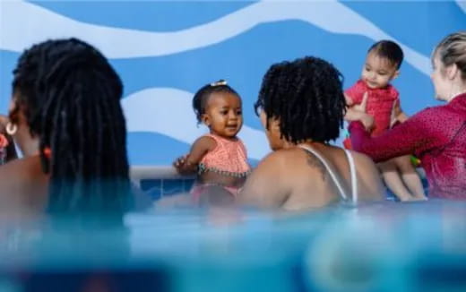 a group of people in a pool