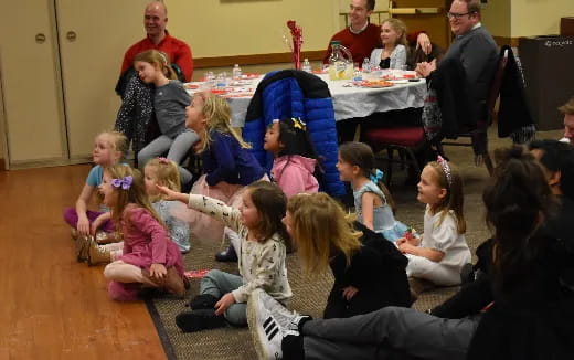 a group of children sitting on the floor