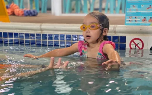 a baby in a pool