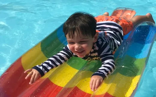 a boy in a pool