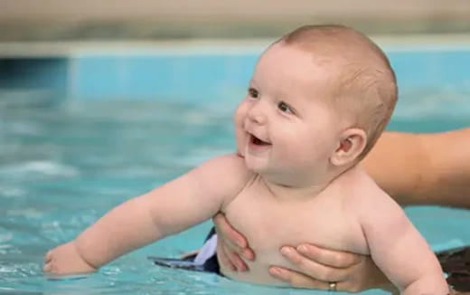 a baby in a pool